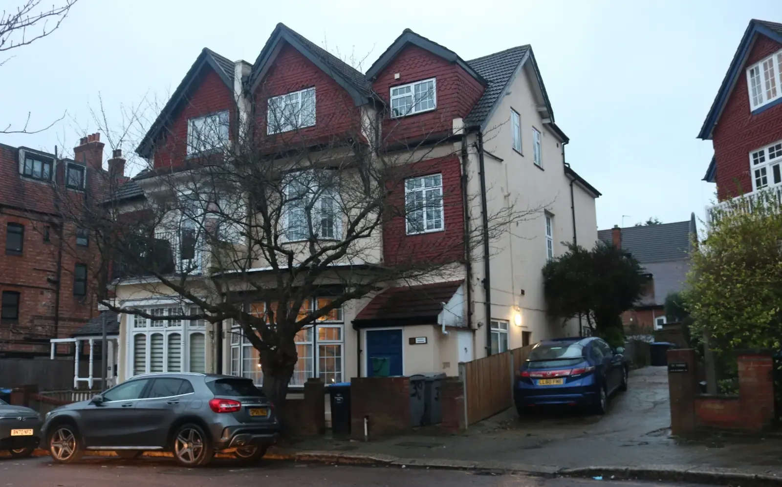 Large Edwardian house on Heathfield Park in Willesden with three tiled gables and a loft extension, a grey car on the drive