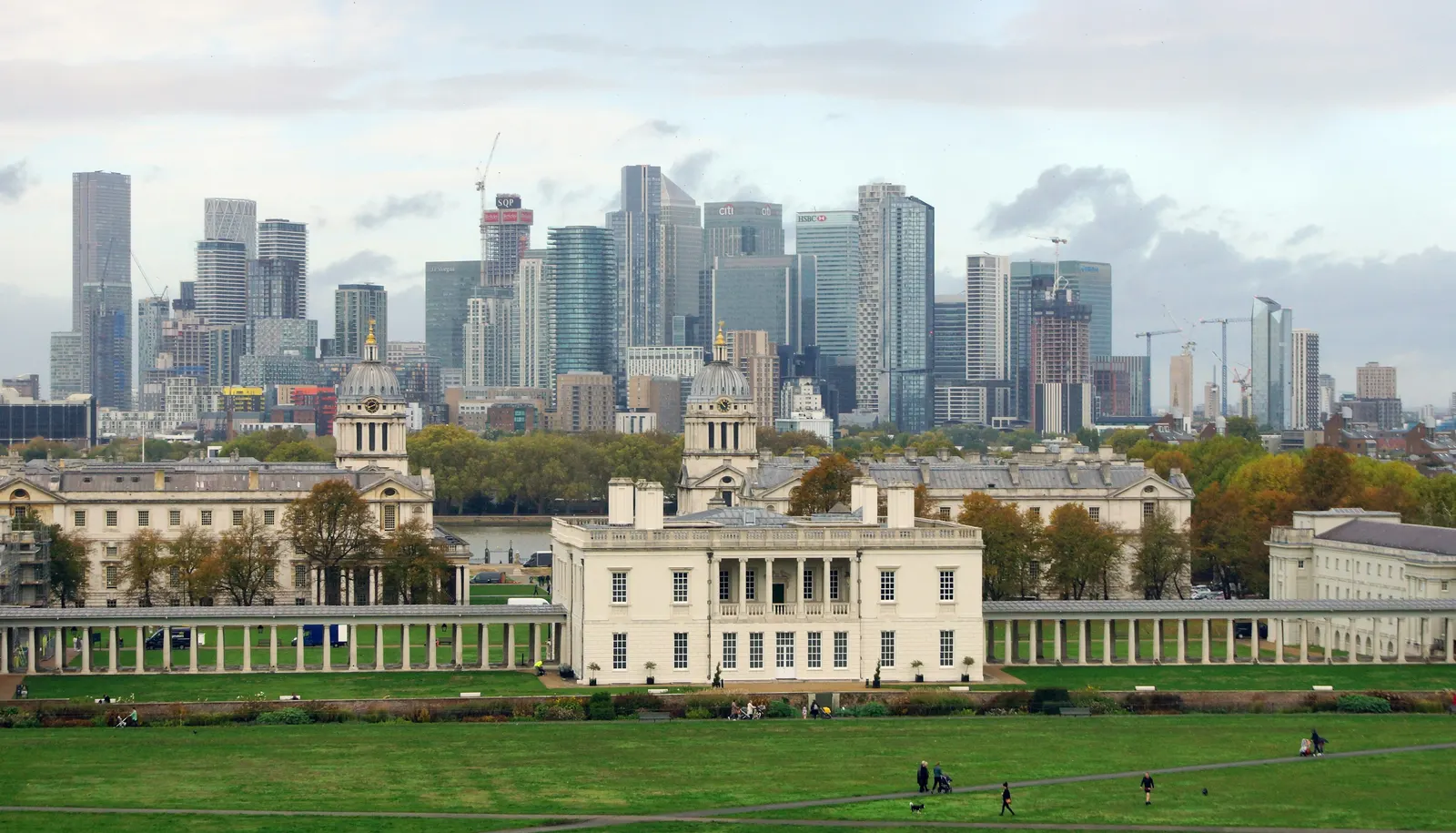 Greenwich's baroque riverside buildings with the Docklands towers behind them, a skyline where historic and new London sit together