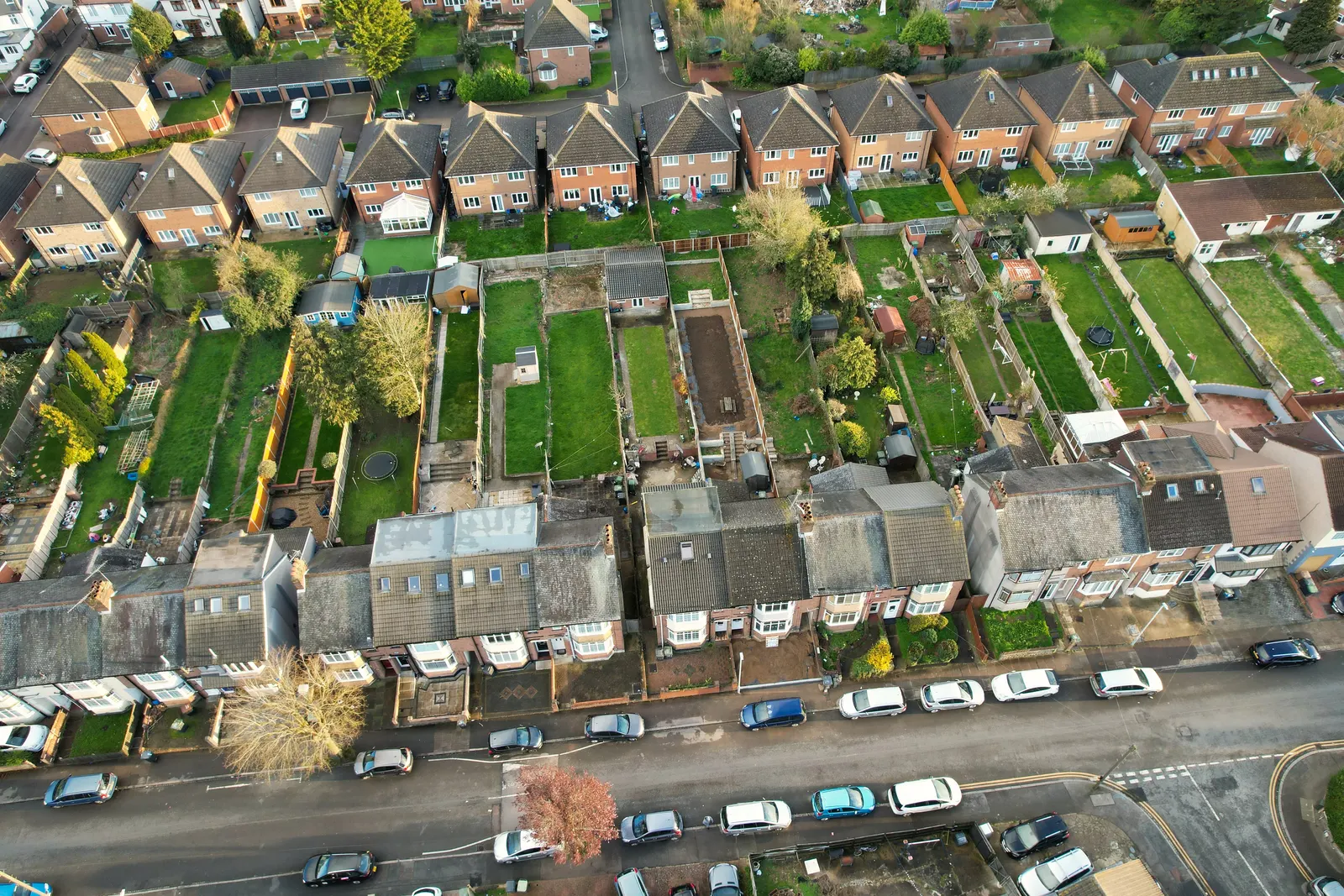 Aerial view of terraced houses and their long back gardens, the setting in which an extension can reduce a neighbour's daylight