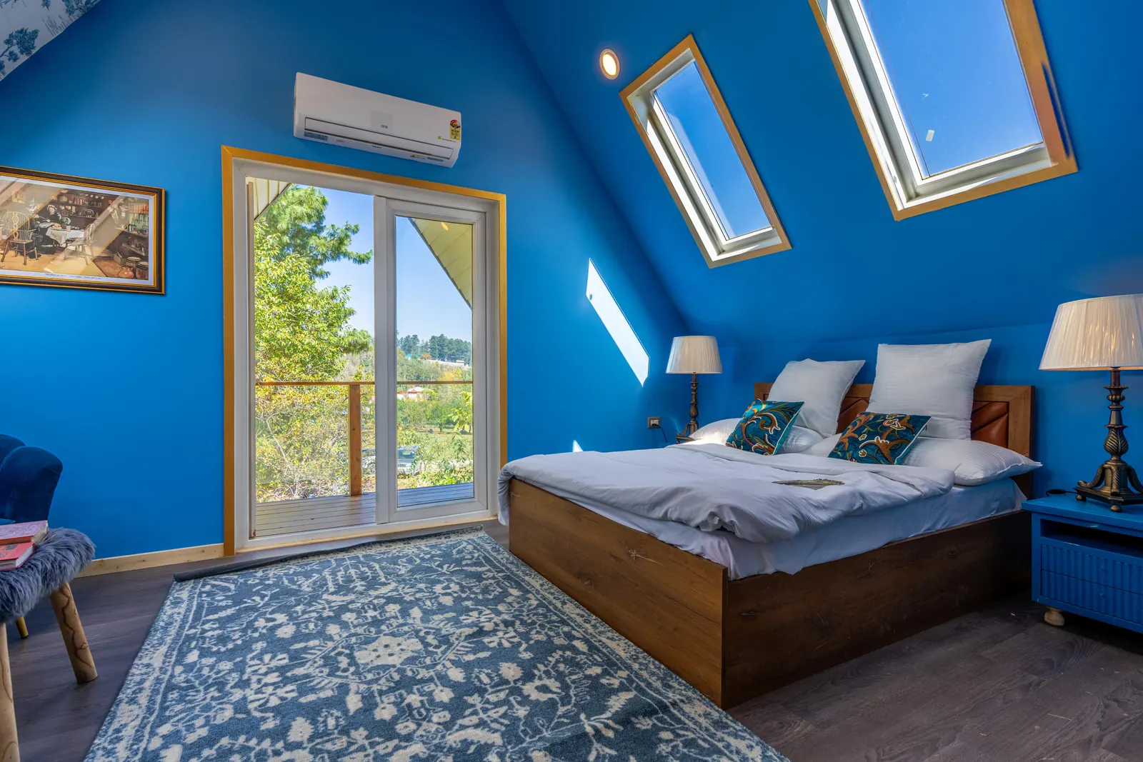Loft bedroom with roof windows and a Juliet balcony, a converted space whose insulation and glazing feed into an energy calculation