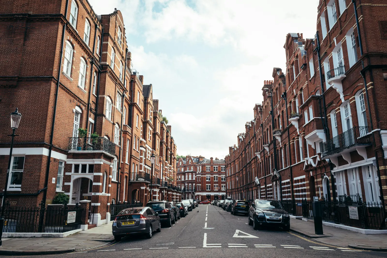 Red-brick mansion blocks lining a quiet London street